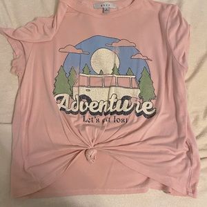 T-shirt, that says “adventure let’s get lost”